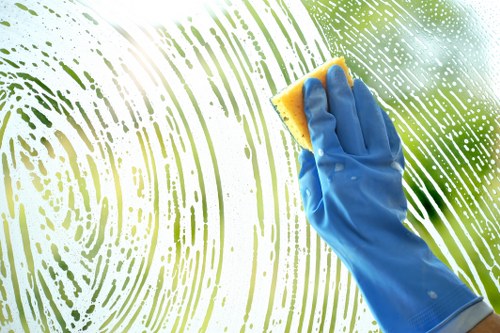 Cleaning technician preparing carpet cleaning equipment in a home interior