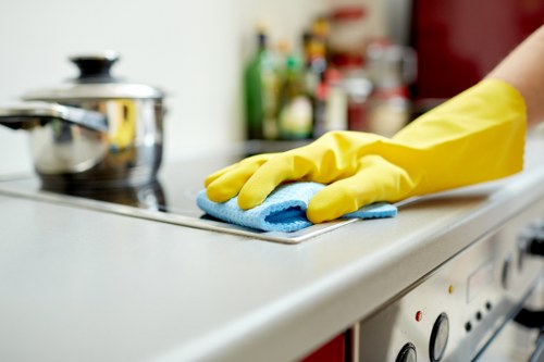 Office cleaner in Wimbledon maintaining a tidy workplace