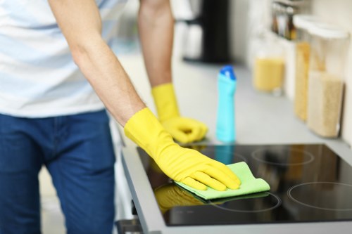 Oven racks and trays being cleaned as part of a Wimbledon oven clean