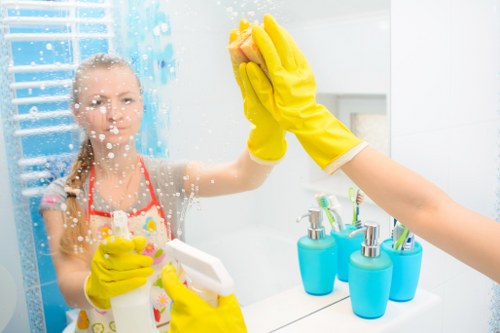 Deep cleaning a kitchen oven with specialist tools in Wimbledon